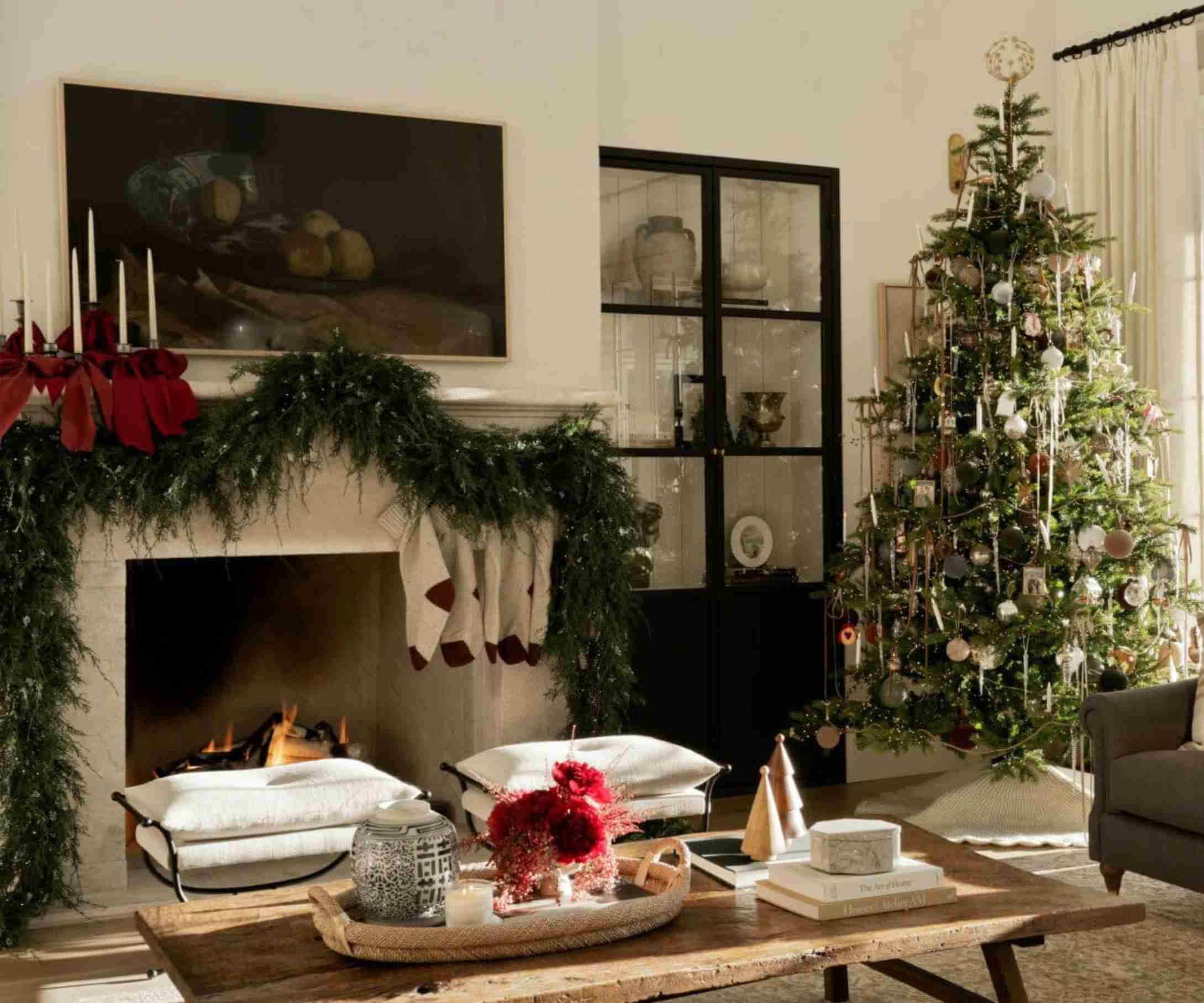 traditional christmas decorations in a neutral living room decorated with a large garland