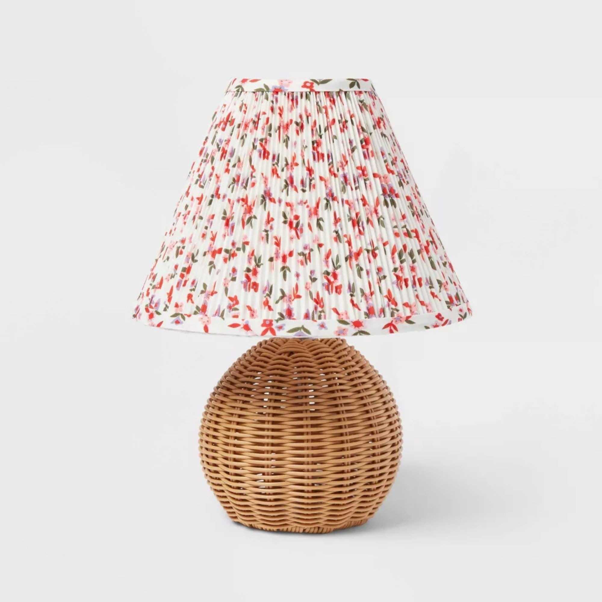 Rattan lamp with a pleated floral-patterned shade included in the shopping edit.