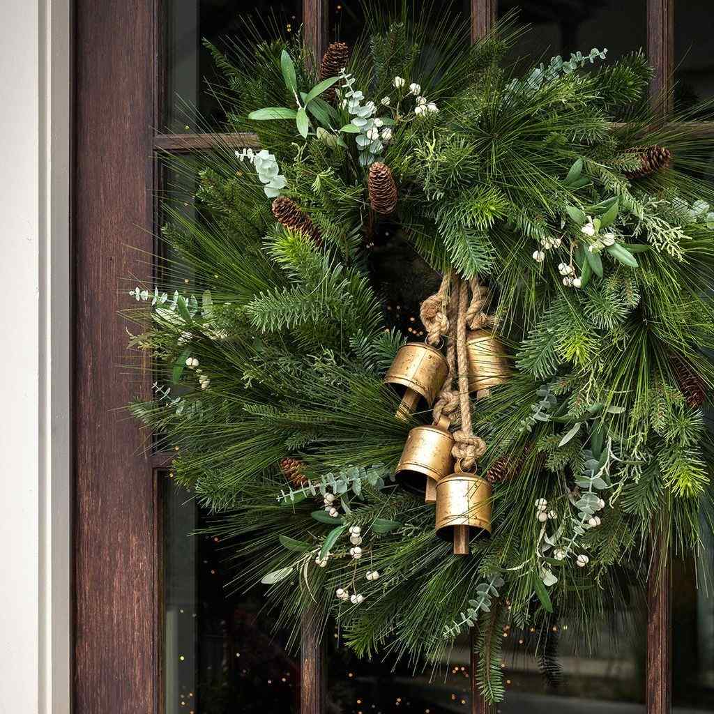 Pinecone and white-berry artificial wreath offered in the Christmas porch edit.