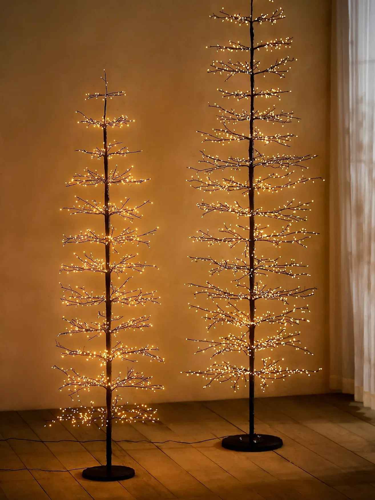 Fine-branched illuminated tree offered in the twig-light shopping edit.