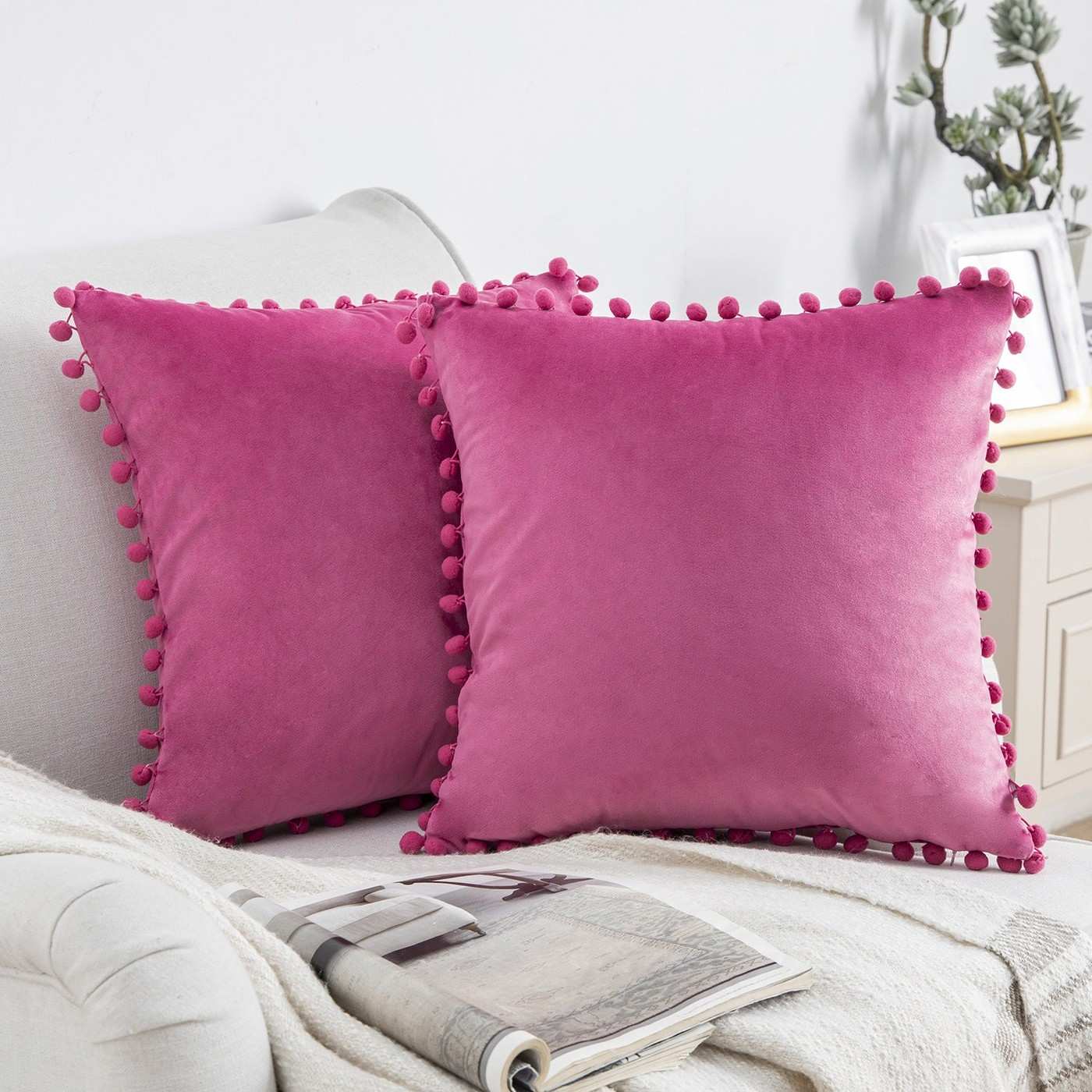 Pink Pillows Bring Focus to a Neutral Living Room